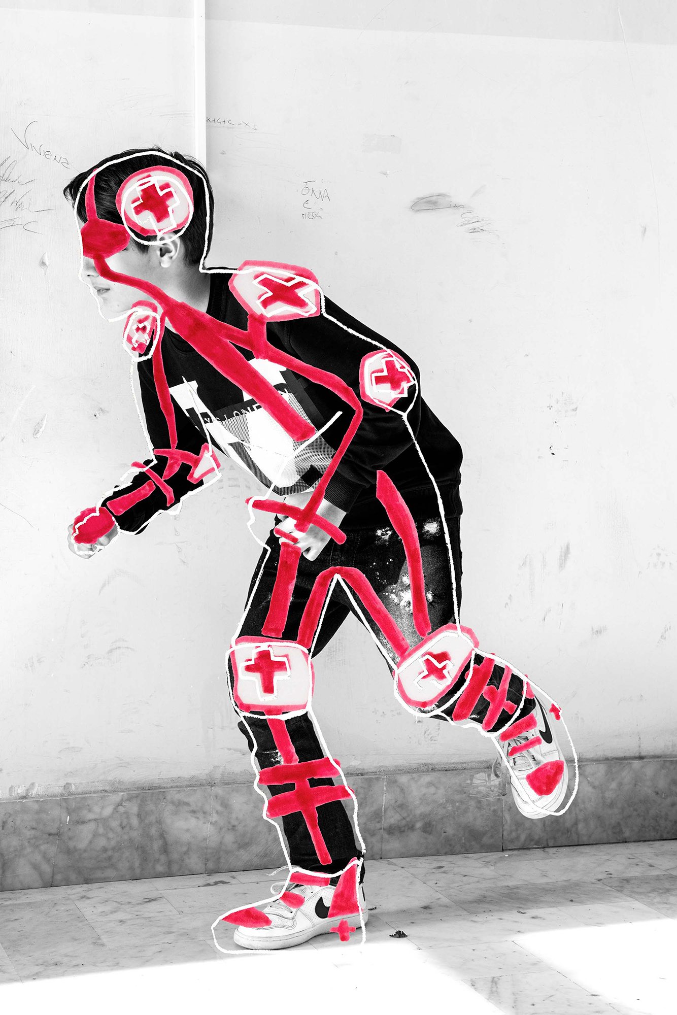 A picture of a person in the middle of a running pose, drawn over with a white outline and bold red lines from their head out to their limbs. Red crosses and white circles mark the person's joints.